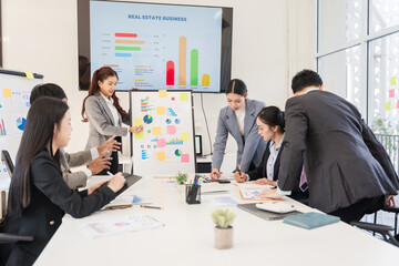Asian business group meeting to give advice on graphing and document work in the office