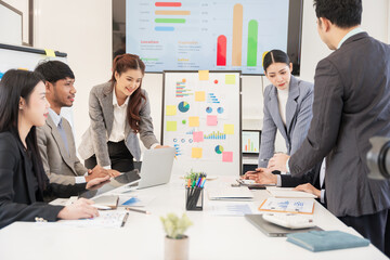 Asian business group meeting to give advice on graphing and document work in the office