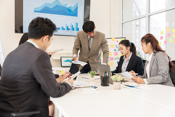 Asian business group meeting to give advice on graphing and document work in the office