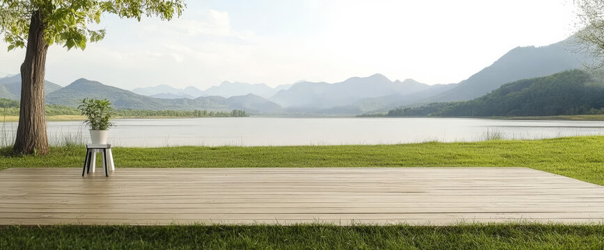 Scenic lakeside view with wooden deck and potted plant during daytime