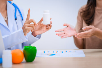 Female Asian nutritionist providing consultations for weight loss. reduce belly fat, offering...