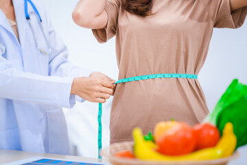 Female Asian nutritionist providing consultations for weight loss. reduce belly fat, offering...