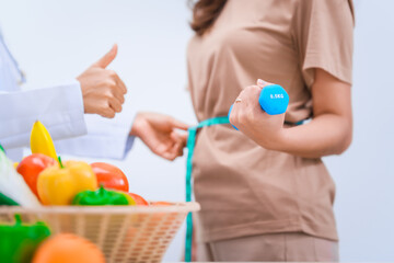 Female Asian nutritionist providing consultations for weight loss. reduce belly fat, offering...