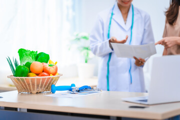 Female Asian nutritionist providing consultations for weight loss. reduce belly fat, offering...