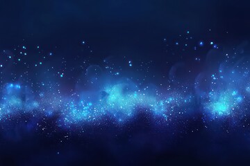 Fototapeta premium A dreamy abstract background featuring glowing blue bokeh lights in varying sizes, creating a soft effect.