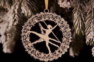 Dancer Ornament on Snowy Christmas Tree.
