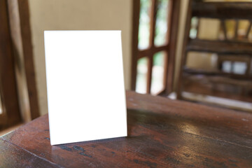Menu mock up blank for text marketing promotion. Mock up Menu frame standing on wood table in...