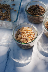 homemade natto fermented soy bean in a glass bowl on marble background.