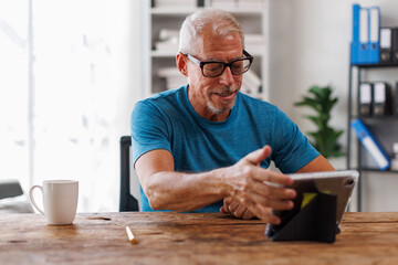 happy Mature Men, Mature Adult, middle aged man, entrepreneur, small business owner working online.using phone and laptop, technology concept