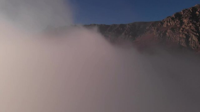 Caucasus, North Ossetia. Alagir gorge. Rocky mountains in the clouds.