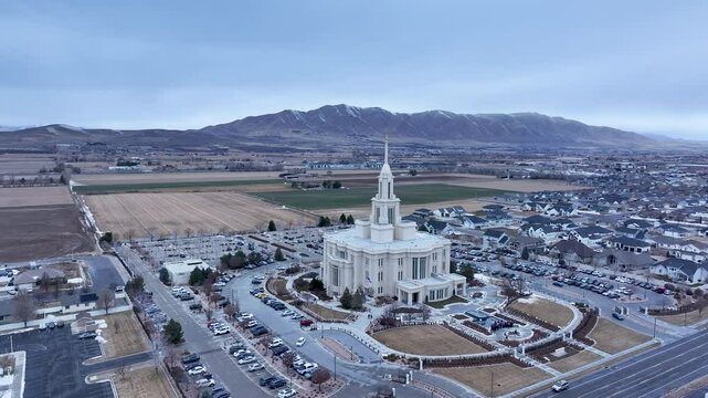 Aerial Payson Utah LDS Temple valley slide circle 3 4K. The Church of Jesus Christ of Latter-day Saints, LDS or Mormon religion. Sacred building for eternal worship. Residential neighborhood.