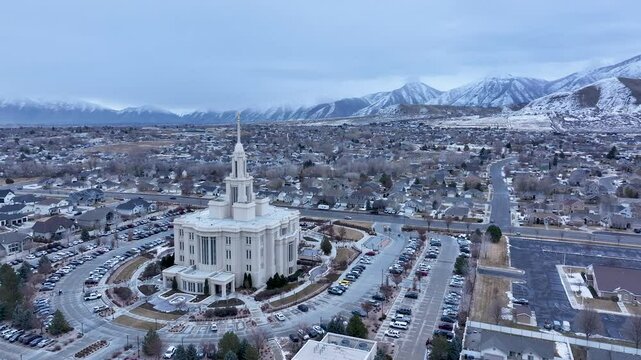 Aerial Payson Utah LDS Temple valley slide circle 2 4K. The Church of Jesus Christ of Latter-day Saints, LDS or Mormon religion. Sacred building for eternal worship. Residential neighborhood.