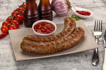 Grilled beef sausages with sauce
