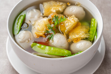 Fish Ball Soup with Fish belly crackers are called hipio