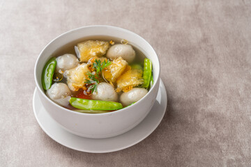 Fish Ball Soup with Fish belly crackers are called hipio