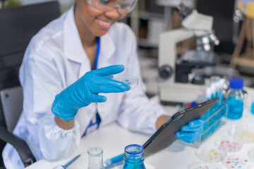 Fototapeta premium Healthcare professional holding vaccine in laboratory study and analyze scientific sample of antibody.