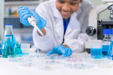 Fototapeta premium Healthcare professional holding vaccine in laboratory study and analyze scientific sample of antibody.