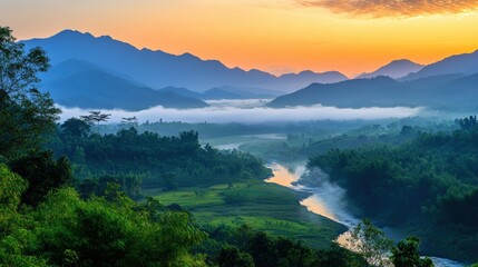 Serene Mountain Sunrise: A mesmerizing panorama of a tranquil valley veiled in mist, punctuated by a winding river, all bathed in the soft, warm hues of a breathtaking sunrise.