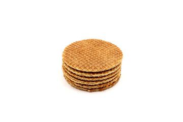 Tasty Dutch stroopwafels in a stack, isolated on a white background.