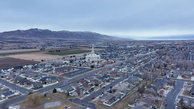 Aerial Payson Utah LDS Temple valley fast 4K. The Church of Jesus Christ of Latter-day Saints, LDS or Mormon religion. Sacred building for eternal worship. Residential neighborhood.
