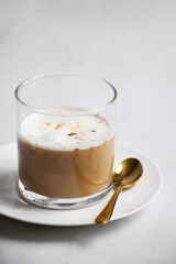 affogato in a glass with sprinkle of coffee on top