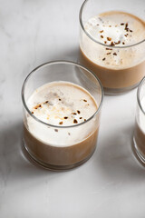 affogato in three glasses with sprinkle of coffee on top