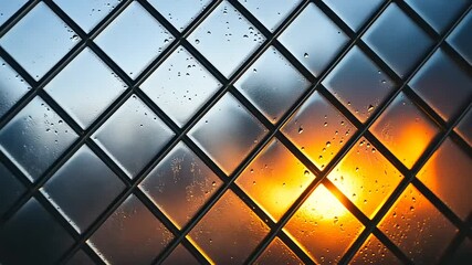 Diamond-patterned glass window pane with condensation, backlit by warm sunset light. - Powered by Adobe