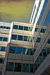 Fototapeta premium Modern Building Facade with Off-White and Reflective Glass Panels in London, UK.