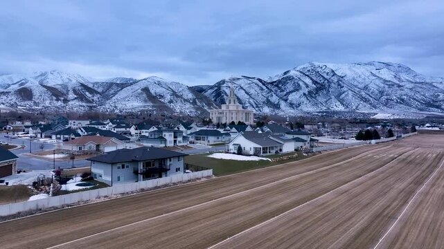 Aerial Payson Utah LDS Temple overhead 1 4K. The Church of Jesus Christ of Latter-day Saints, LDS or Mormon religion. Sacred building for eternal worship. Residential neighborhood.