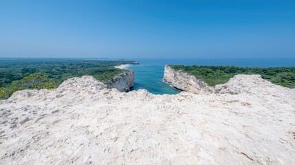 Coastal clifftop view, turquoise ocean inlet, lush green foliage, sunny day, travel postcard