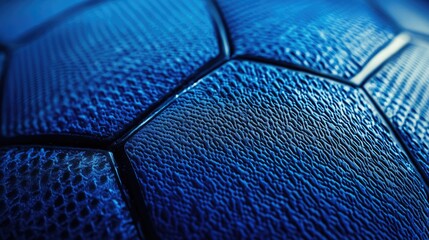 Close-up Macro Shot of a Textured Blue Soccer Ball, Showcasing the Intricate Surface Patterns and Hexagonal Design, Perfect for Sports and Recreation Themes