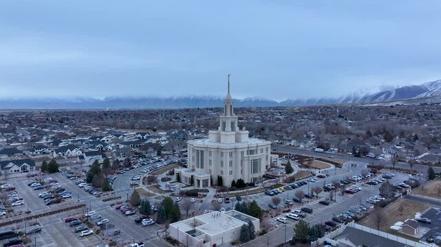 Aerial LDS Temple Payson Utah mountain valley circle 3 4K. The Church of Jesus Christ of Latter-day Saints, LDS or Mormon religion. Sacred building for eternal worship. Residential neighborhood.