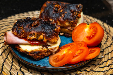 Ready -made cheese sandwich with ham and tomato