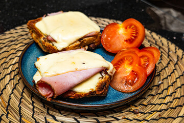 Ready -made cheese sandwich with ham and tomato