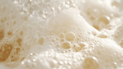 Fototapeta premium Close-Up View of Bubbles and Foam Creating a Soft and Smooth Creamy Texture in a Liquid Surface, Perfect for Various Culinary and Beverage Themes