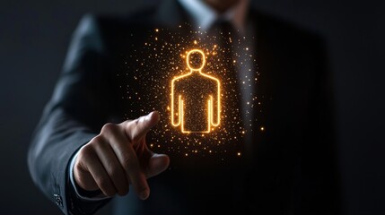 A professional man points at a glowing human figure icon, symbolizing leadership, innovation, or digital transformation in a corporate environment.