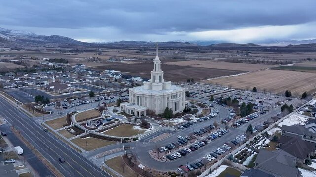 Aerial Payson Utah LDS Temple mountain valley circle 5. The Church of Jesus Christ of Latter-day Saints, LDS or Mormon religion. Sacred building for eternal worship. Residential neighborhood.