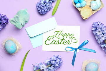 Composition with beautiful hyacinth flowers, blank greeting card and Easter eggs on lilac background