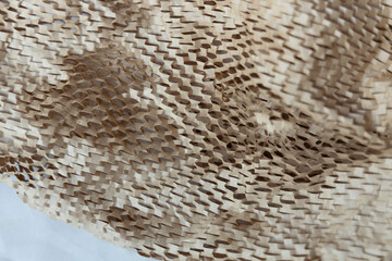 Brown paper packaging filler for shipping box, close up.