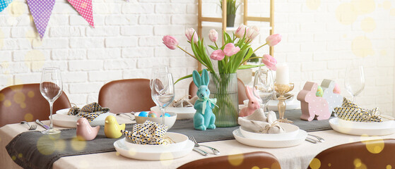 Interior of dining room with table served for Easter celebration