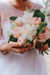 pink and white wedding bouquet of roses