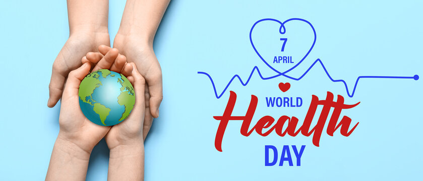 Hands of woman and child holding red heart on blue background