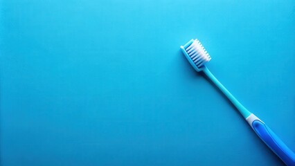 A single blue toothbrush lays on a bright blue background, ready for a fresh and clean start to the day.