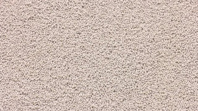 White heap pile of salt granules of phosphoric (phosphate) fertilizers on chemical plant.  Organic chemical fertilizers in production plant warehouse 
