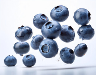 Falling blueberries isolated on white