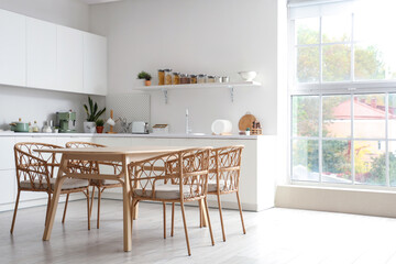 Clean wooden table in interior of modern kitchen