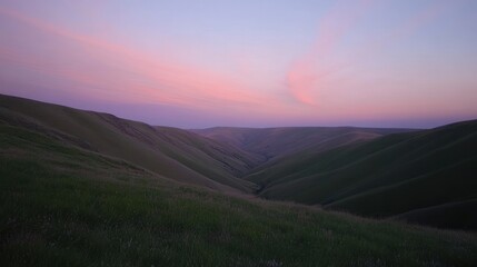 Serene Sunset Over Rolling Green Hills Landscape