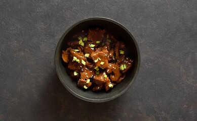Beef with soy sauce, green onion and sesame seeds