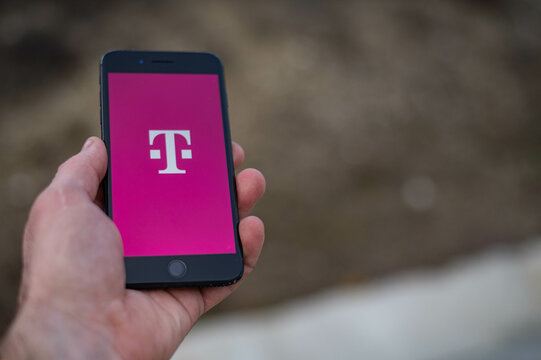  t-mobile logo on phone screen stock image.