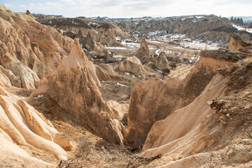 Rock formations of the Red Valley (Valley of Roses), Cappadocia, Turkey , in winter.